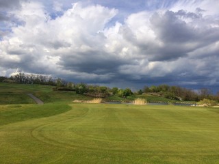Fototapeta na wymiar On a empty golf course before storm
