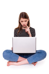 Young Woman with PC hand on chin E-commerce Stock Image