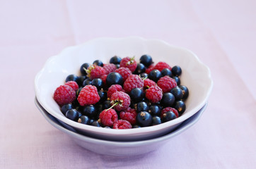 Mix of wild raspberry and black currant in a bowl