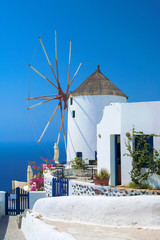 old traditional windmill in Oia village of Santorini, Greece - obrazy, fototapety, plakaty