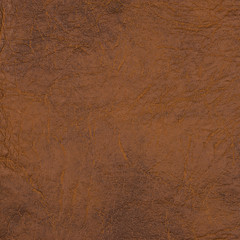 Brown leather texture closeup background.
