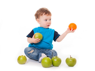 Fototapeta premium baby with apples and orange isolated on white