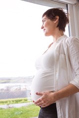 Pregnant woman holding her bump