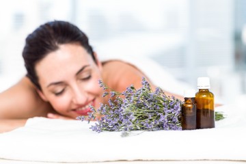 Smiling woman getting an aromatherapy treatment - obrazy, fototapety, plakaty