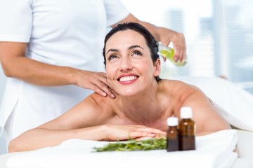 Obraz na płótnie Canvas Smiling woman getting an aromatherapy treatment