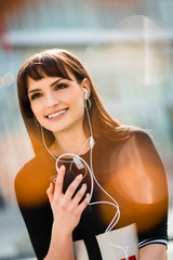Woman calling phone in street