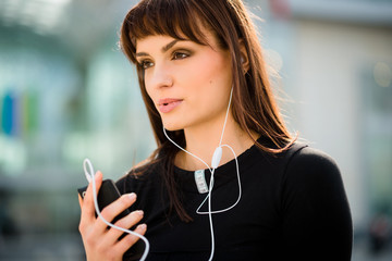Woman calling phone in street