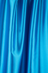 Blue silk background. Texture.