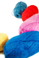 Close up of wool knitting on white background. Selective focus