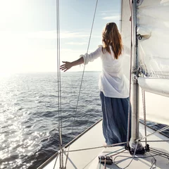 Aluminium Prints Sailing woman staying on sailboat