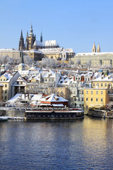 Fototapeta premium Snowy Prague gothic Castle above River Vltava, Czech Republic