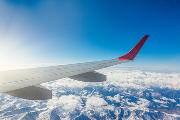 View of the mountains from airplane window during flight