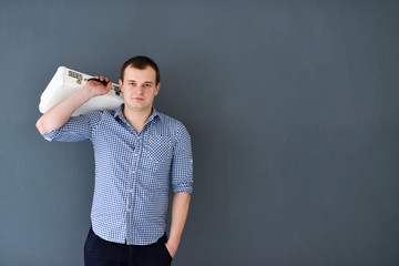 Portrait of a young man with shoulder bag isolated 