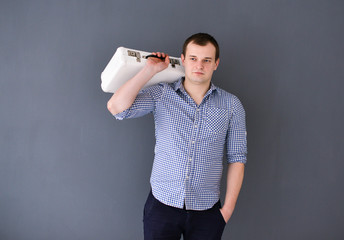 Portrait of a young man with shoulder bag isolated 