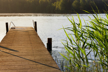 Lake and pier at summer morning