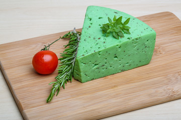 Green pesto cheese and basil leaves