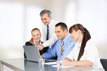 Business. Business people working on a laptop