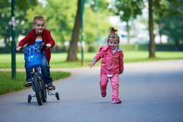 boy and girl with bicycle