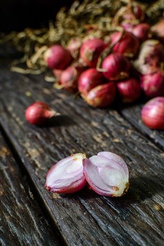 Shallot onions on old wooden table