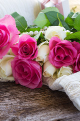 pink and orange roses with lace