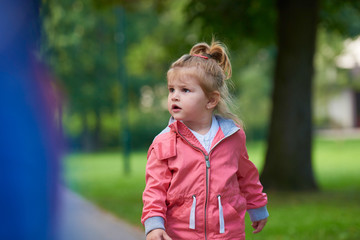 Fototapeta premium little girl have fun in park