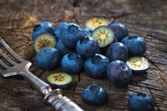 Fresh blueberries on wooden background