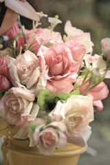 Fototapeta na wymiar Beautiful vintage roses of artificial flowers