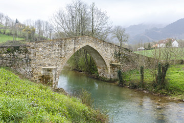 Fototapeta na wymiar Ceceda medieval bridge in Asturias