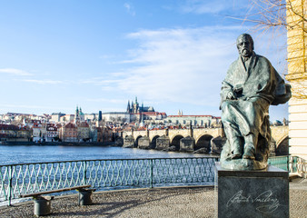 Fototapeta premium view of prague castle with statue of bedrich smetana