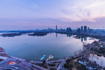 modern nanjing city skyline with the beautiful lake at night