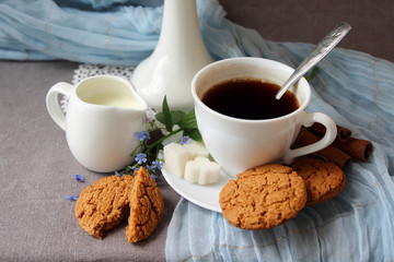 me-nots, a cup of coffee and oatmeal cookies.