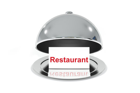 opened silver cloche with white sign restaurant