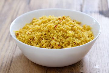 cous cous in white bowl