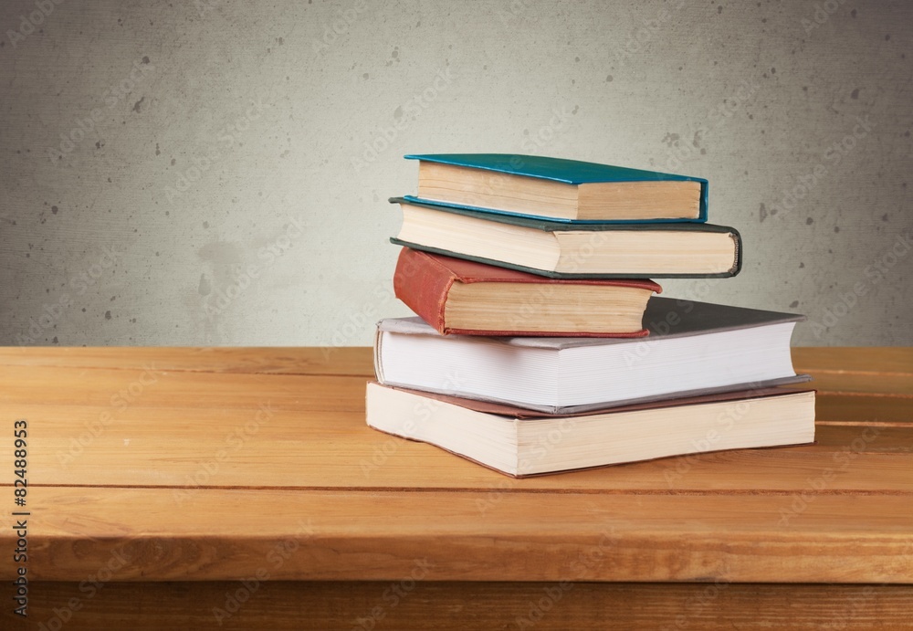 Sticker Retro. Vintage old books on wooden deck table over grunge