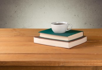 Tea. Vintage books and cup of tea on wooden table