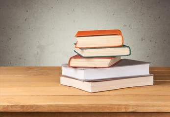 Retro. Vintage old books on wooden deck table over grunge