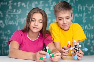 Obraz na płótnie Canvas Academic. Teenage schoolchildren examining molecular structure