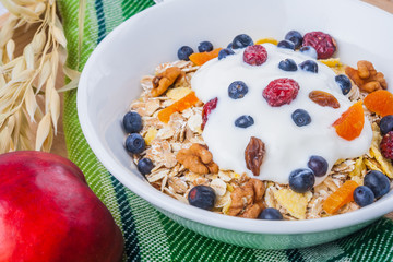 Breakfast of oatmeal with blueberries and yogurt