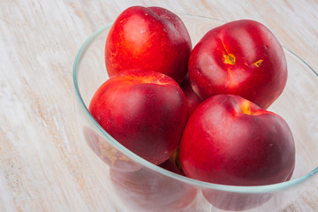 Nectarines in a glass bowl