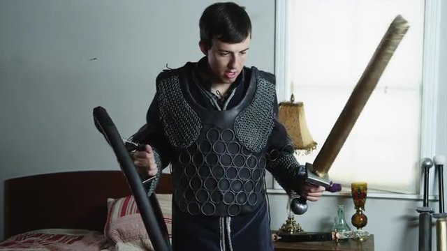 MS Man wearing armor playing with sword / Orem,Utah,USA