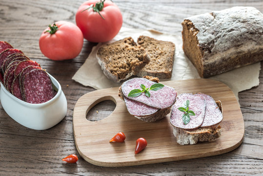 Sandwiches with salami and tomatoes