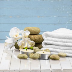 Spa Treatment. Gladiola, towel, candles and river stones