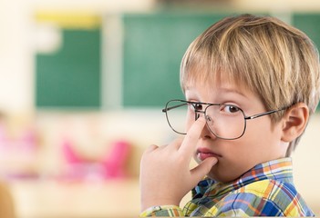 Chalkboard. Thoughtful boy funny portrait with abstract idea