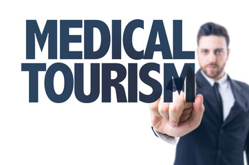 Business man pointing the text: Medical Tourism