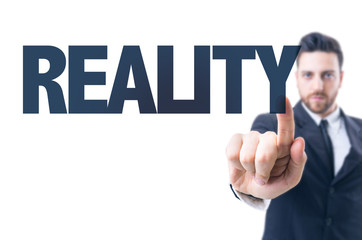 Business man pointing the text: Reality