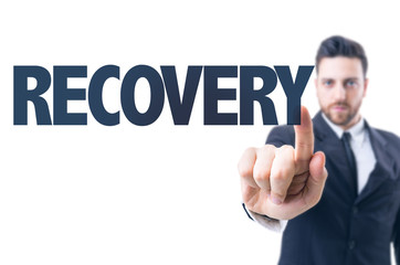 Business man pointing the text: Recovery