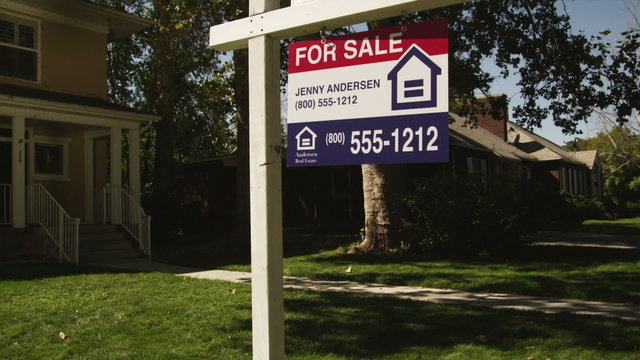 MS TU "For Sale"  and "Foreclosure" signs in front of suburban house, Provo, Utah, USA