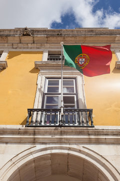 Portugal flag waving on the wind in front an administrative buil