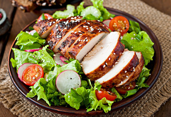 Fresh vegetable salad with grilled chicken breast