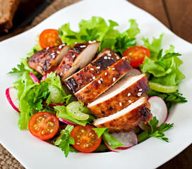Fresh vegetable salad with grilled chicken breast